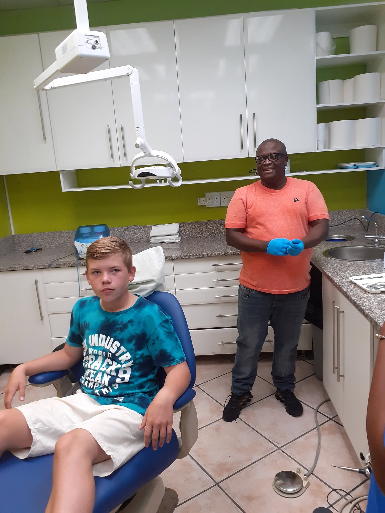 Teenage patient prepared in the chair for a dental braces fitting appointment